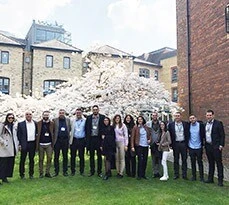 Participants on the Al-Mada programme in the garden of a Cambridge College.