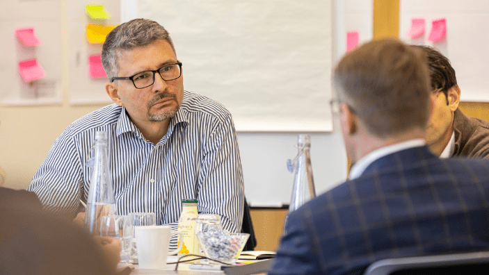 Participants engaging in discussion during an Executive Education session.