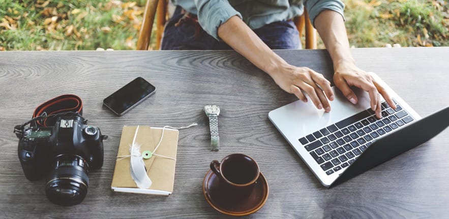 Female blogger writing on the laptop