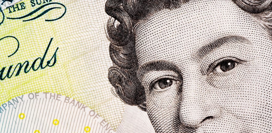 Close up of a five pound note, showing the head of Queen Elizabeth II