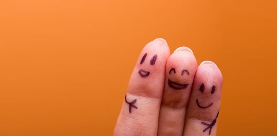 three smiling fingers that are very happy to be family, family concept