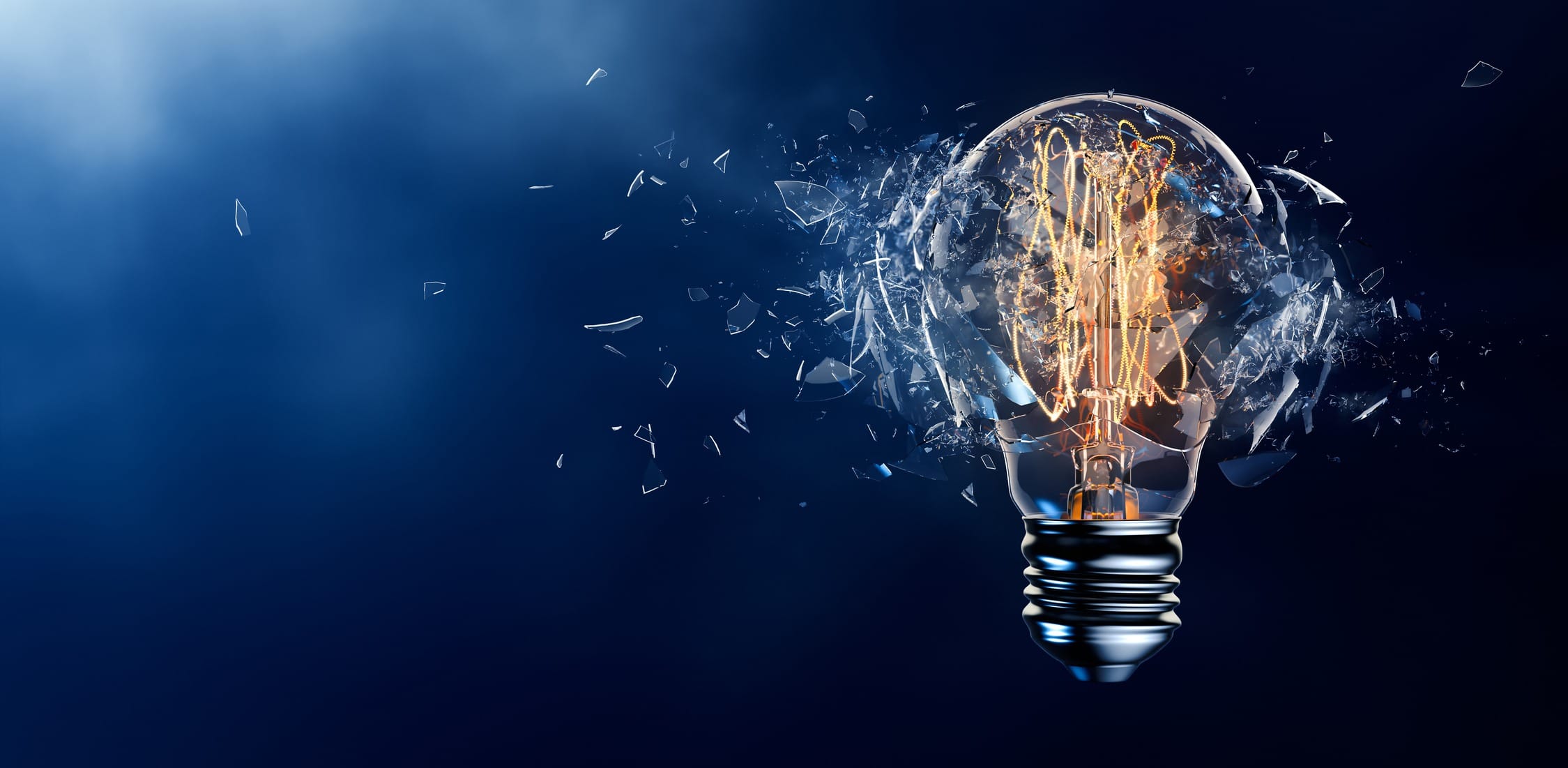 Exploding light bulb on a blue background