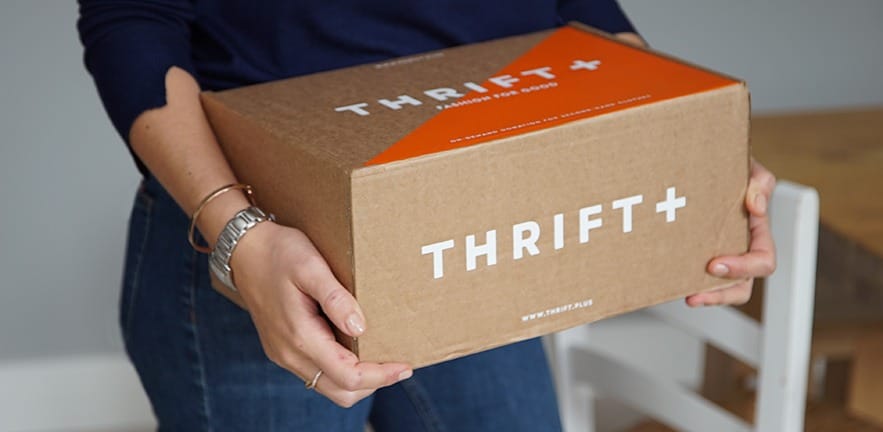Woman holding a Thrift+ box.