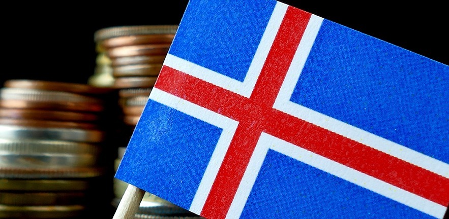 Icelandic flag with coins behind