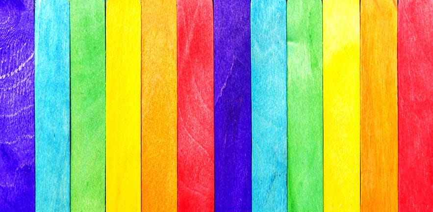 Boardwalk floorboards painted in rainbow colours.