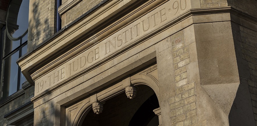 The School's old name engraved above the entranceway.