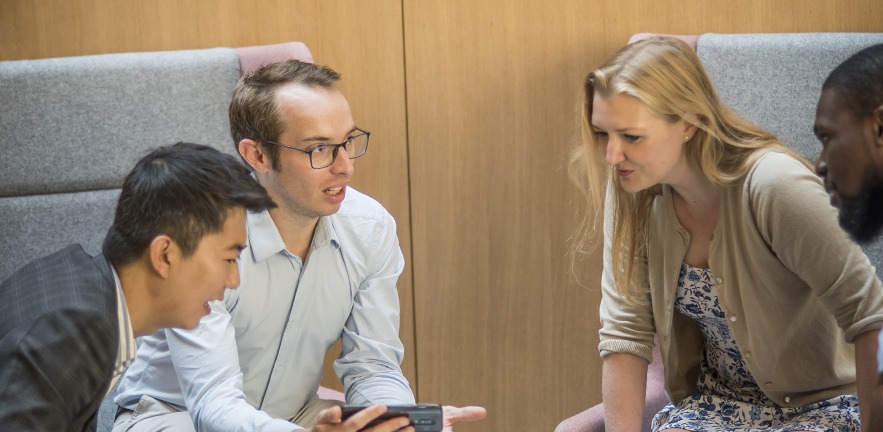 Group of MBAs having a discussion.