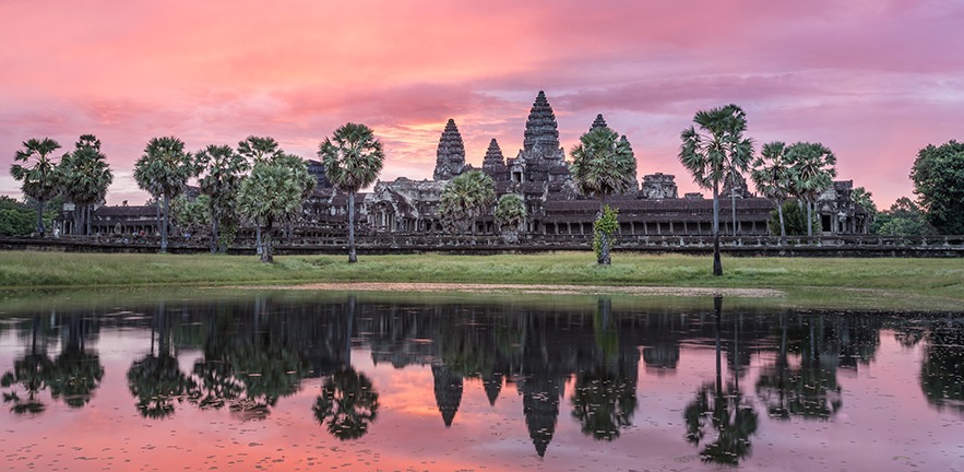 The pink hues of Sunrise over the Angkor Wat temple in Siem Riep, Cambodia.