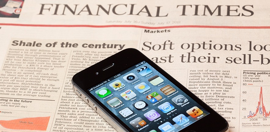 Mobile phone on Financial Times newspaper
