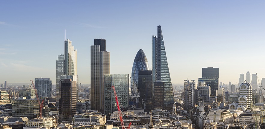 Elevated view of The City of London, early morning. The capital's global business and finance district employs hundreds of thousands of people. The City's skyline is constantly evolving, to the right of the distinctive 'Gherkin', Tower 42 and Heron Tower skyscrapers is the new 'Cheesegrater' skyscraper.