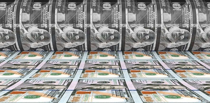 Image of US dollars being printed.