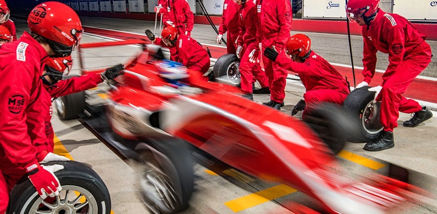 Picture of racing car in pitstop.