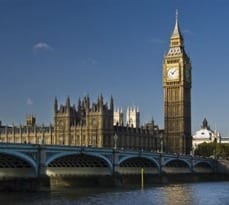 Early morning lights up the top Big Ben across the Thames River.