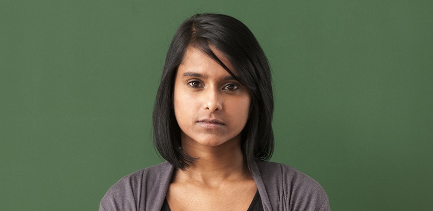 An Indian woman stares at the camera.