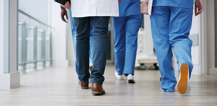 Healthcare workers walking.