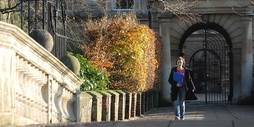 Student on the bridge of one of the colleges.