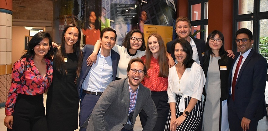 A group of MBA students meet at the energy conference.