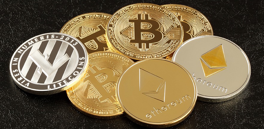 Close up of three main cryptocurrencies: Bitcoin, Ethereum and Litecoin.