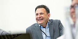 Smiling man in classroom.