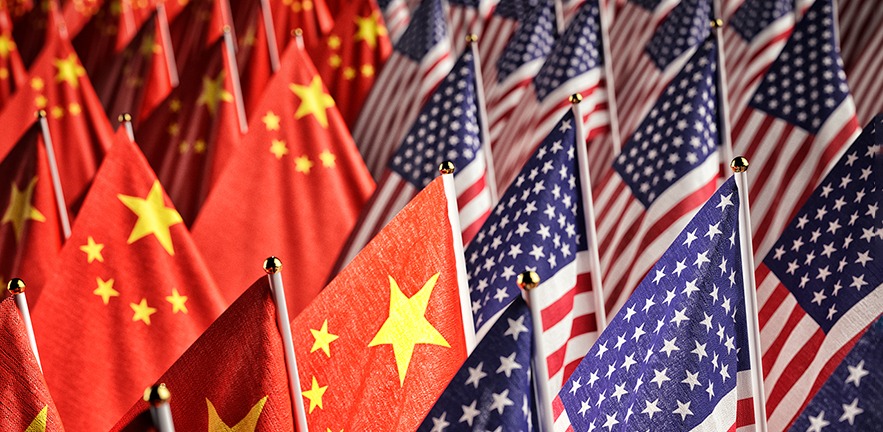 Many American and Chinese national flags together.