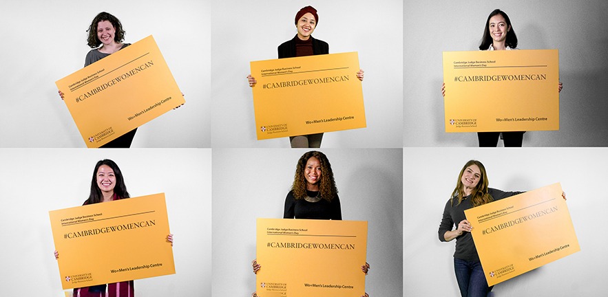 CJBS Women holding up a yellow placard that says "Cambridge women can".