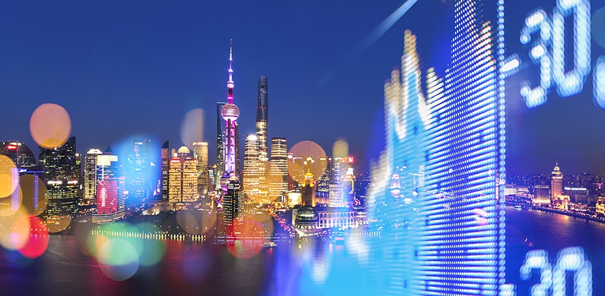 Shanghai cityscape with digital stock market overlay.