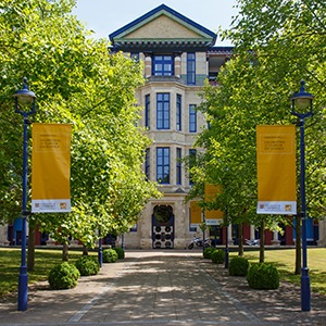Cambridge Judge Business School building on a sunny day.