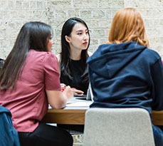 Three women studying together.
