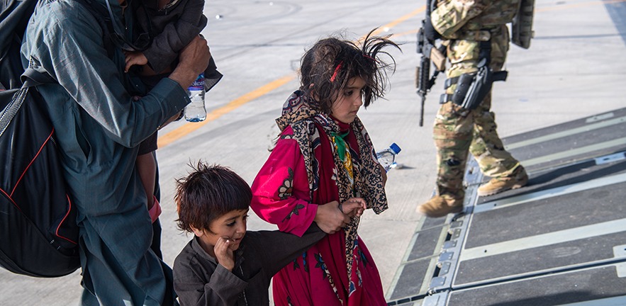 Passengers aboard a U.S. Air Force C-17 Globemaster III assigned to the 816th Expeditionary Airlift Squadron in support of the Afghanistan evacuation at Hamid Karzai International Airport (HKIA), Afghanistan.