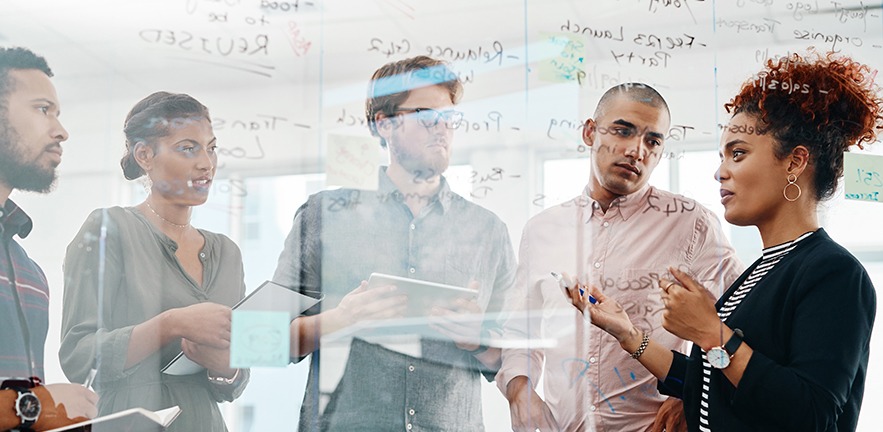 Shot of a group of young entrepreneurs having a brainstorming session in a modern office.