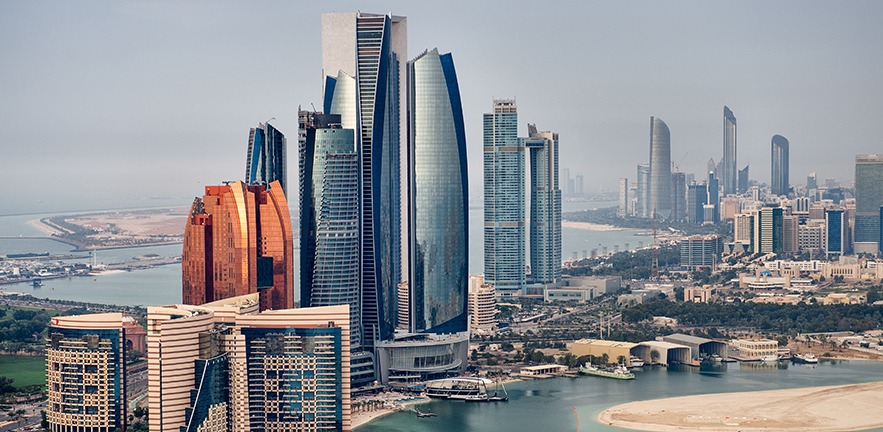 Helicopter point of view of Abu Dhabi skyline with surrounding area.