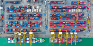 Bird's eye view of a shipping yard with hundreds of colourful containers.