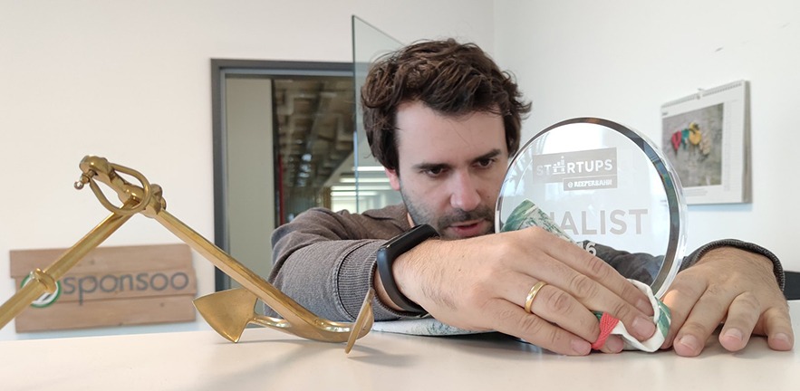 Andreas Kitzing looks at a trophy.