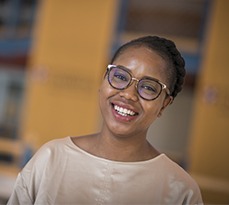 Female MBA student in CJBS smiling.