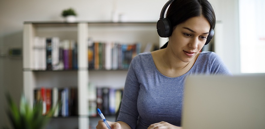 Young woman reading one of the most downloaded papers from the Journal of Small Business Management.