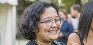Smiling female MBA student outside.