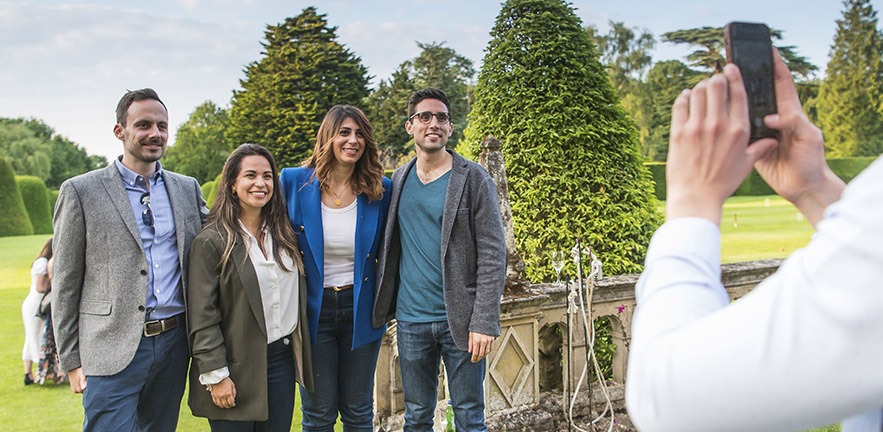 A group of MBA students having their photo taken.