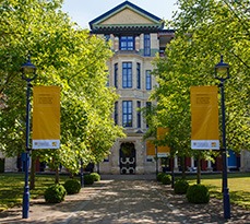 CJBS: front of Addenbrooke's yellow banners flying.