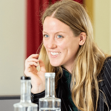 A smiling Executive Education female delegate.
