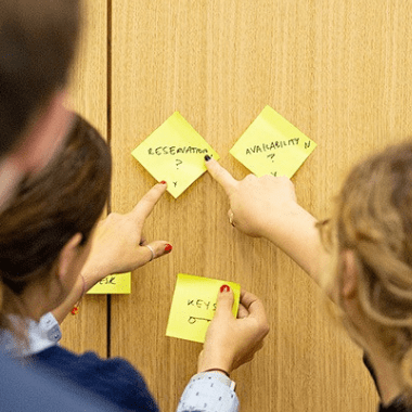 Delegates writing down ideas.