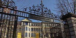 Cambridge Judge Business School building and gate.