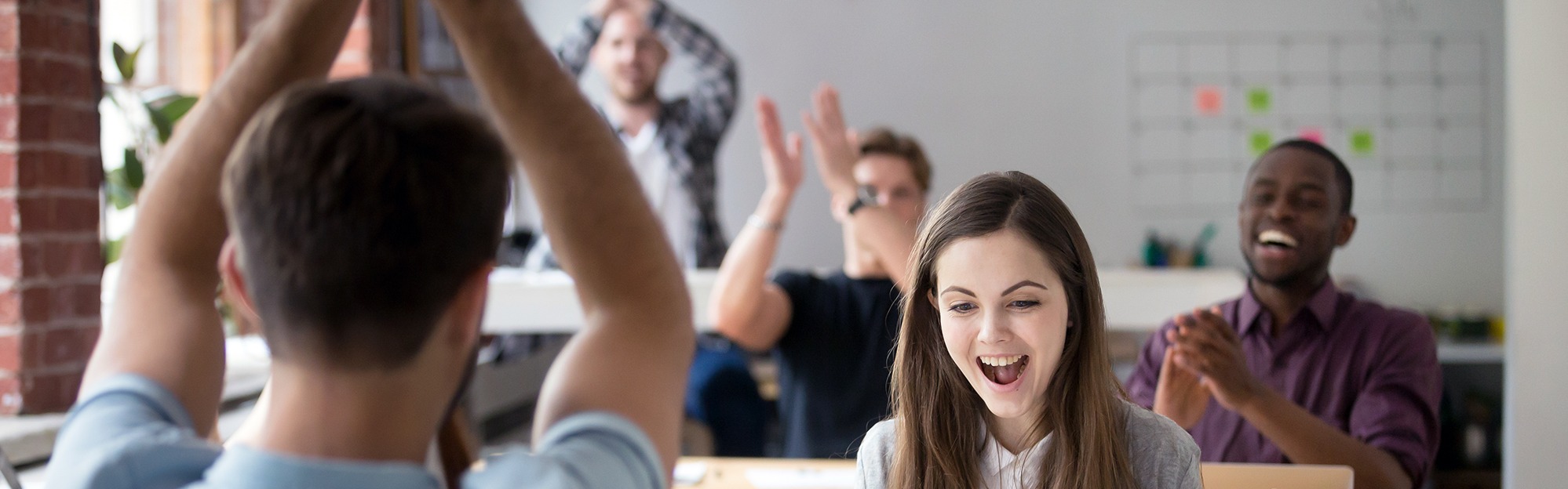 Office colleagues congratulating happy woman excited by good news online.