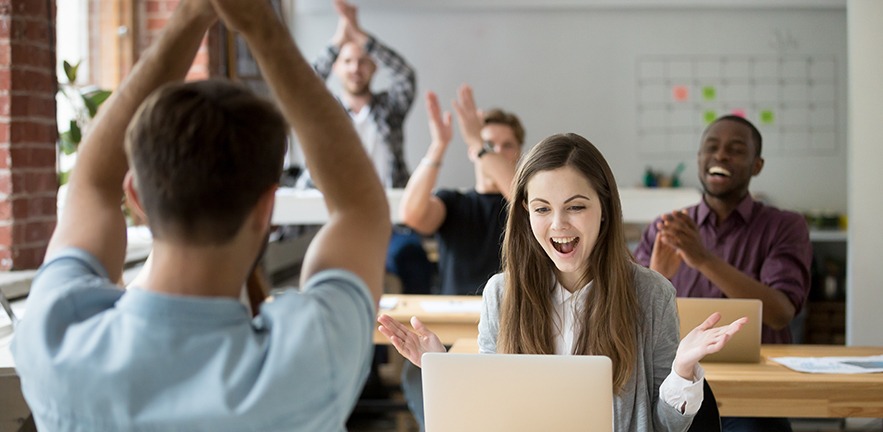 Office colleagues congratulating happy woman excited by good news online.