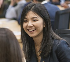Smiling female Asian student.