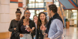 A group of MSt in Entrepreneurship students laughing.