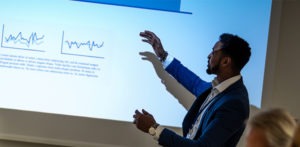 African-American businessman giving a presentation.