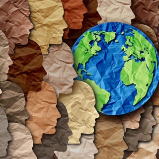 Illustration of the Earth among faces of different ethnicities.