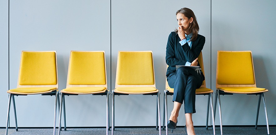 Stressed young woman waiting for job interview.