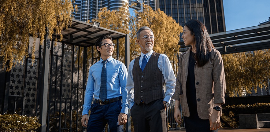 The CEO of a family business talks to his daughter and son.