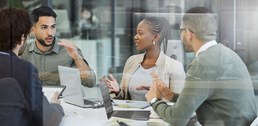 Shot of a group of businesspeople having a meeting in an office at work.